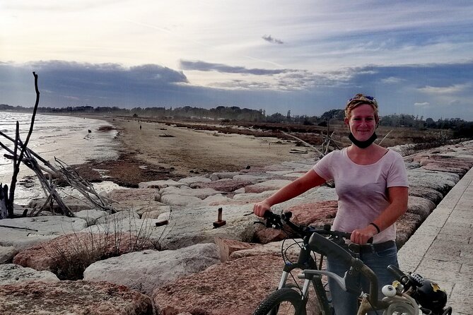 Lido Bike Tour: With a Local on the Island of Cinema - The Faro di San Nicolò and the coastline view that ties it together
