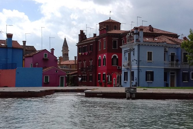 Murano Glass Experience With a Visit to a Burano Lace Island - Quick Pause at Santi Maria e Donato: A Tiny Church Stop with Big Atmosphere