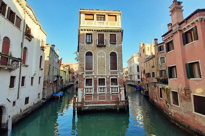 Walking Tour and Enchanting Gondola Journey in Venice - Canal Grande from the water: palaces, churches, and daily boat life